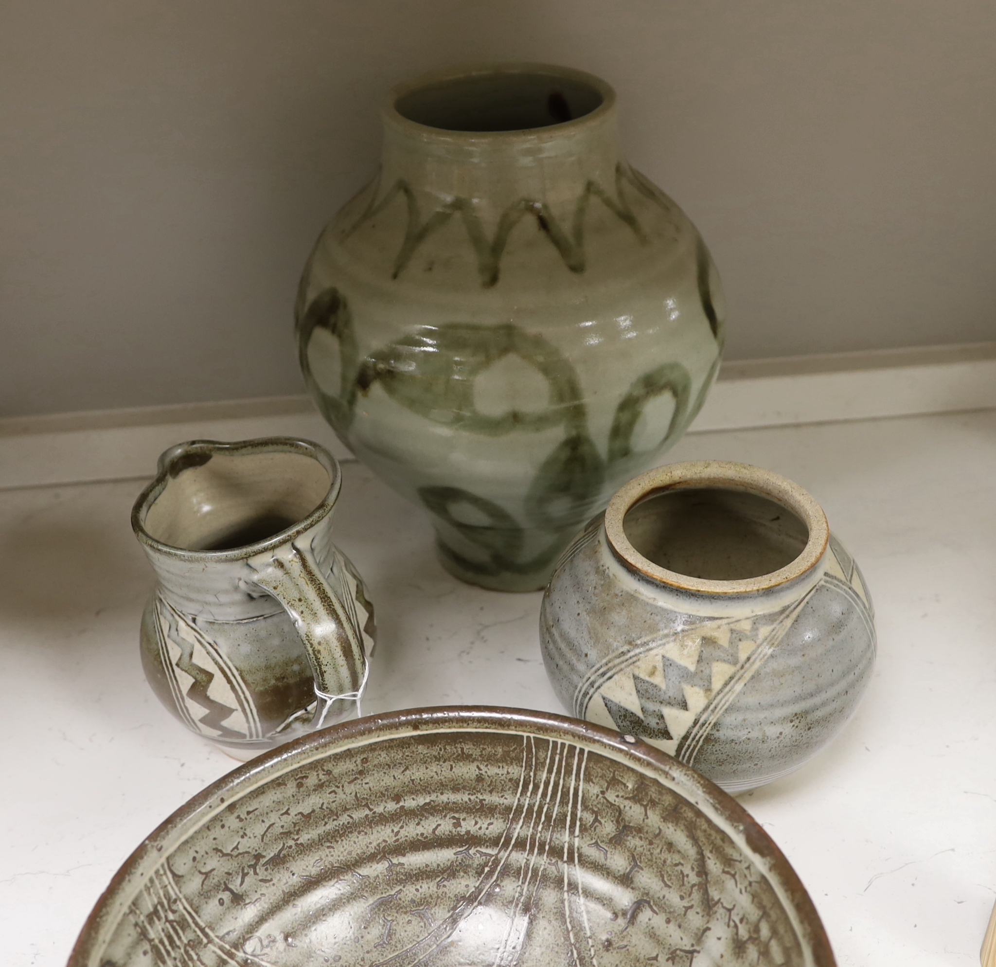 A 1961 Studio pottery vase and two bowls, a Studio pottery 'Gloucester' vase and a jug, largest 28cm high